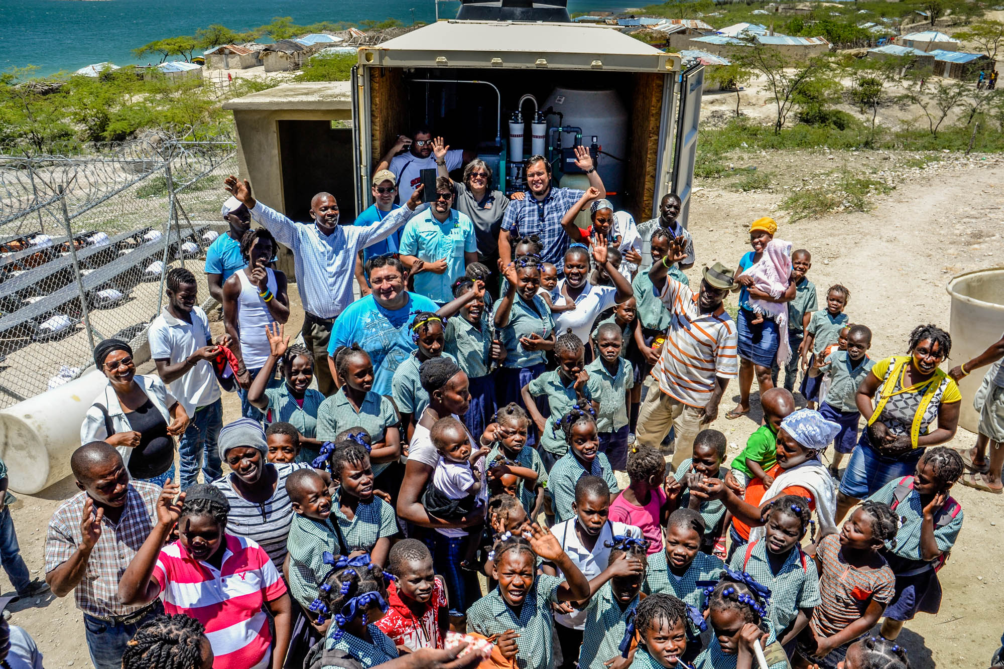 People from Po Ploom in Haiti together with professors and students celebrating 